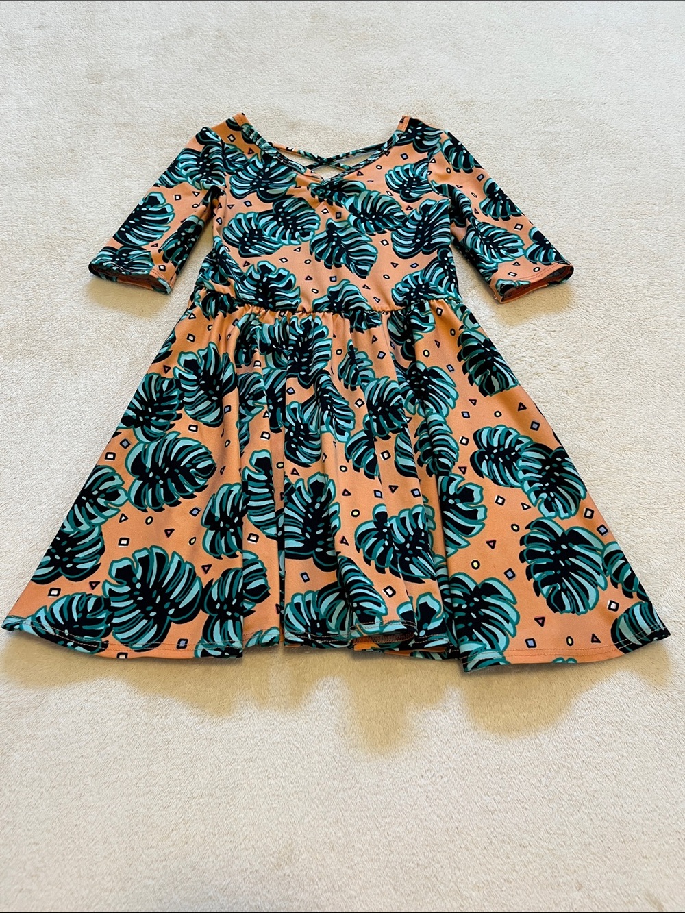 Dot Dot Smile | Little Girls Peach Monstera Leaf Dress 3/4